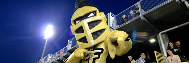 Knightro points at the camera.