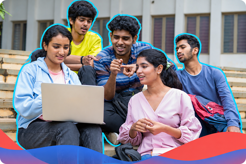 Young people gathered around a laptop