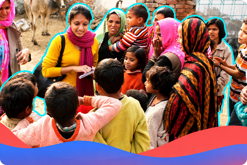 Women and children smiling in colorful clothing